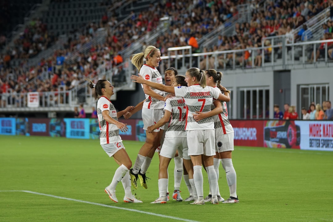 soccer players celebrating goal