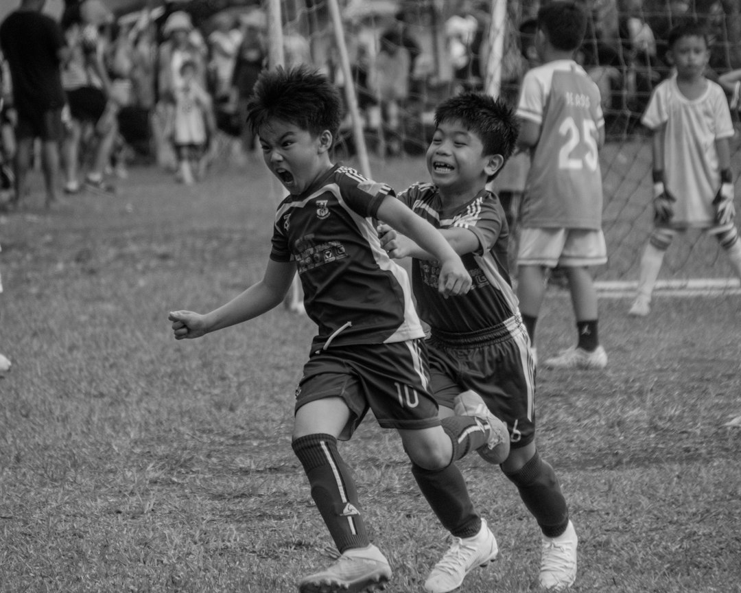 soccer players celebrating goal